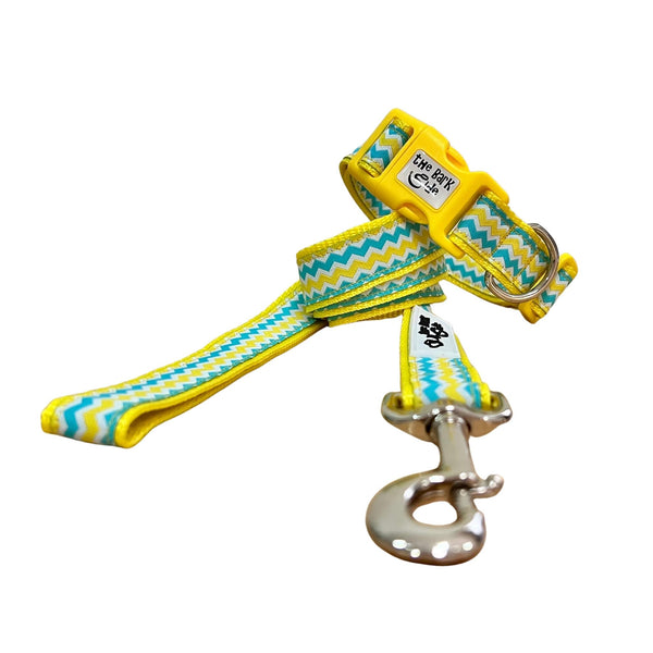 Dog collar and leash featuring a blue, yellow and white waves pattern on yellow webbing.