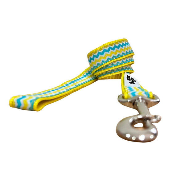 Dog leash featuring a blue, yellow and white waves pattern on yellow webbing.