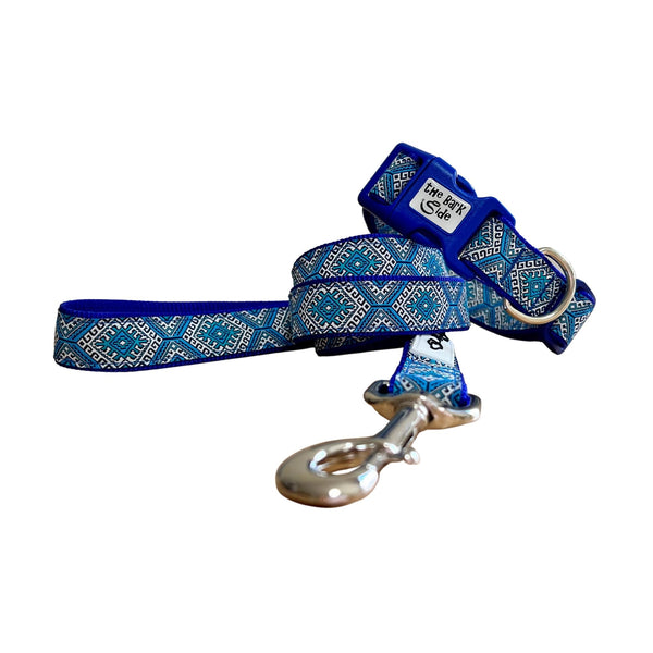 Dog collar and leash featuring Aztec themed ribbon on royal blue webbing.