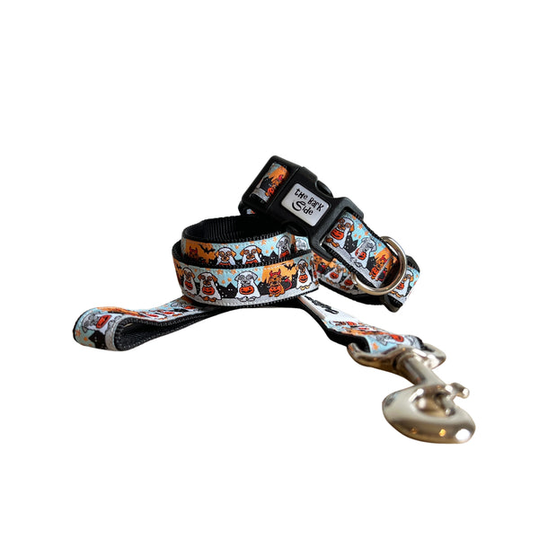 Dog collar and leash featuring a spooky Halloween themed design on a multi coloured ribbon. The collar and leash have black webbing.