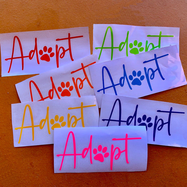 'Adopt' stickers in red, orange, yellow, green, blue, purple and pink. All have a white background.