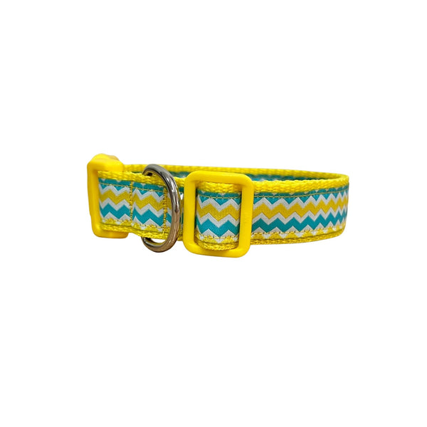 Dog collar featuring a blue, yellow and white wave themed ribbon on yellow webbing.