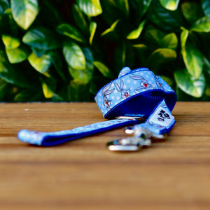 Dog leash featuring a blue ribbon with Bugs Bunny pattern, on blue webbing. 