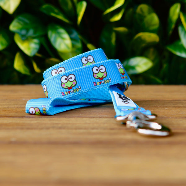 Dog leash featuring a blue ribbon with Keroppi frog theme on baby blue webbing. 