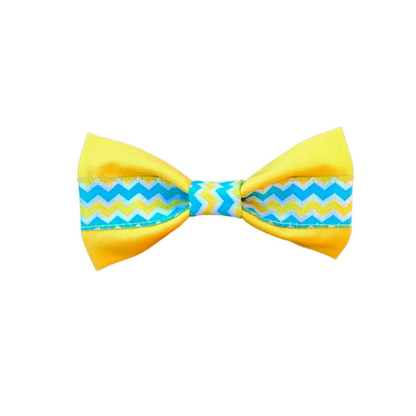 Yellow bow tie with blue, yellow and white chevron ribbon. White background.