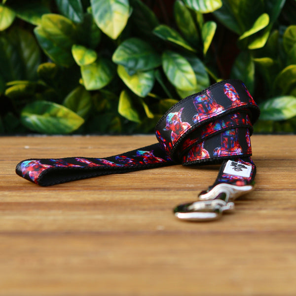 Dog leash featuring a black ribbon with retro Star Wars pattern, on black webbing. 