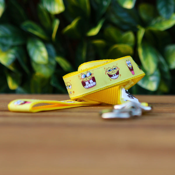 Dog leash featuring a yellow ribbon with Spongebob Squarepants faces, on yellow webbing.